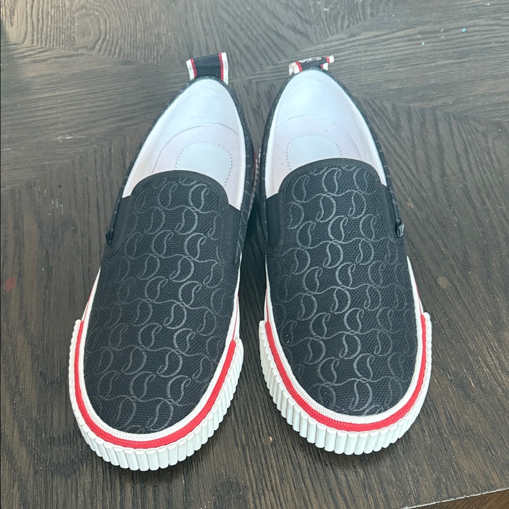Brand new Christian Louboutin Black and White Boat Shoes